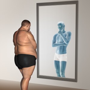 overweight vs slim fit with muscles young man on diet reflecting in a mirror